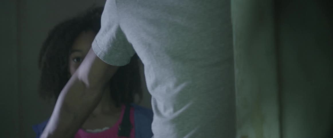 A young girl is being held back by an older gentleman