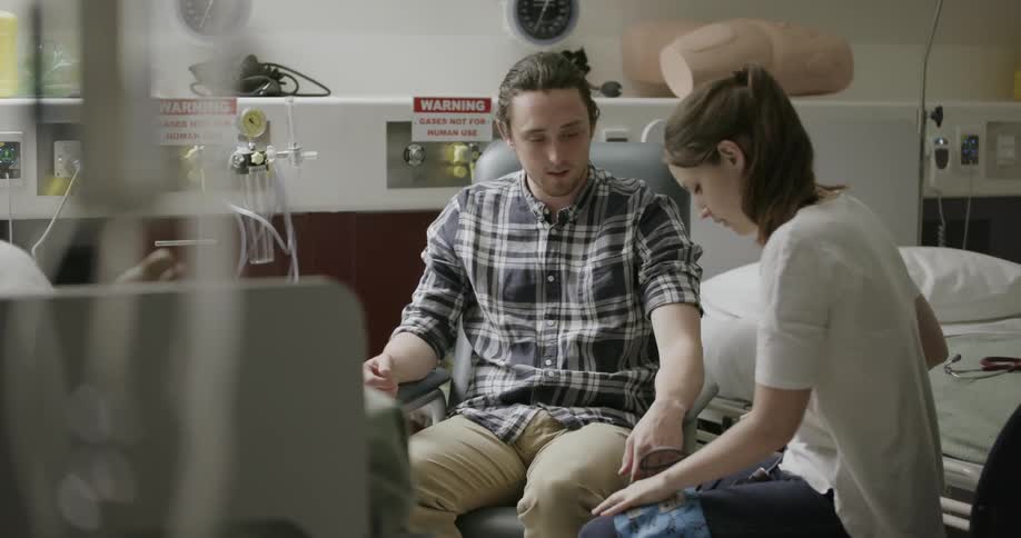 A nurse is speaking with a patient