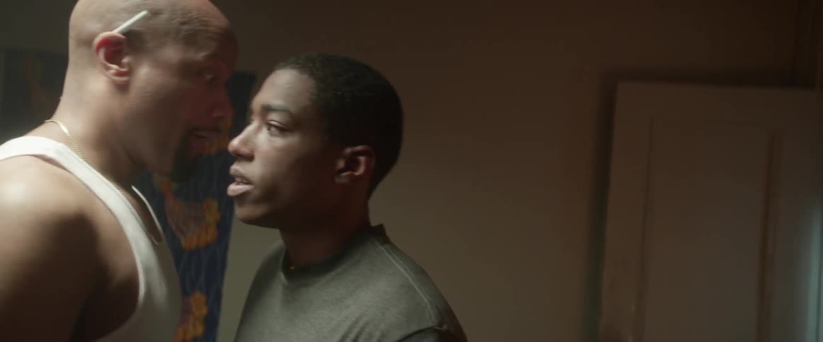 A man is yelling at his son in the living room
