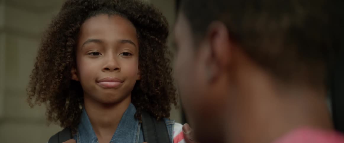 Child smiles at her father