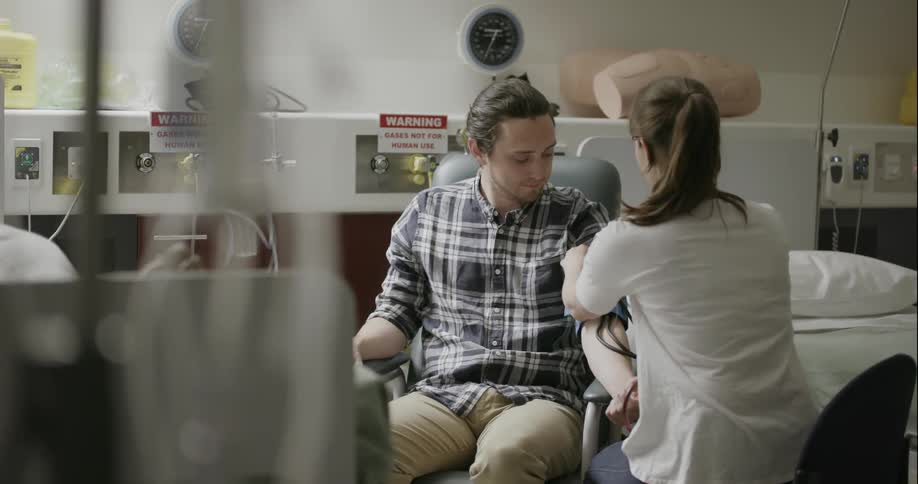 A man getting a test done by a doctor