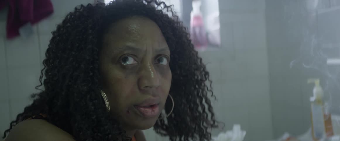 A woman looks up worried