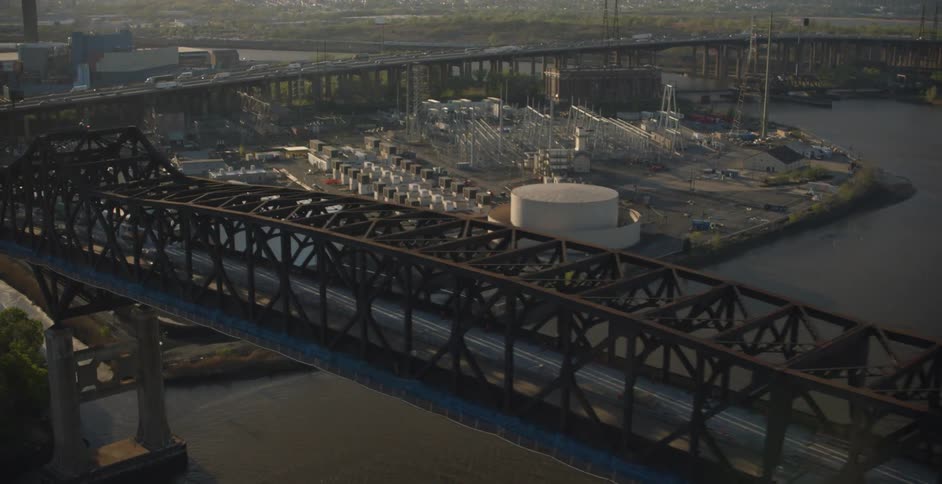 A riverside city and bridge in the morning