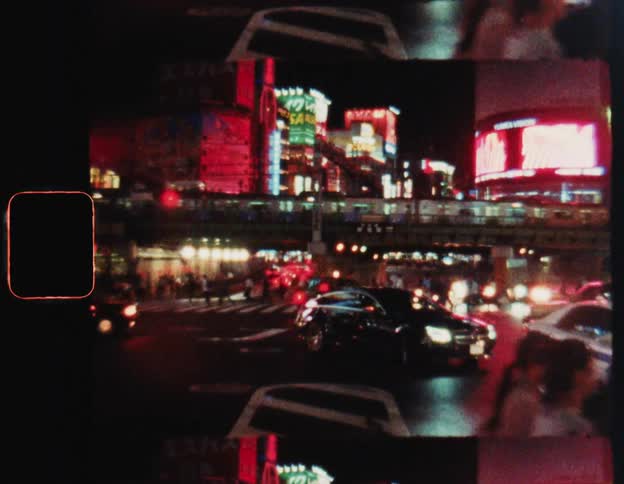 Chaos of vehicle and pedestrian traffic on the streets of a metropolis at night