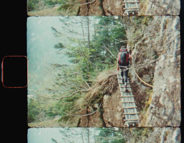 Man climbing stairs on a mountain