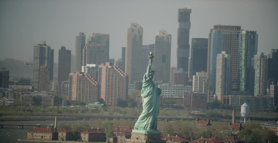 The empire state building sits before the city