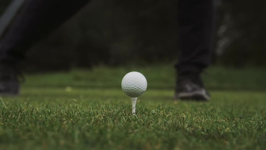 Club throwing a golf ball