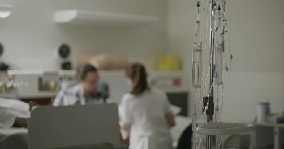 A doctors tends to a patient