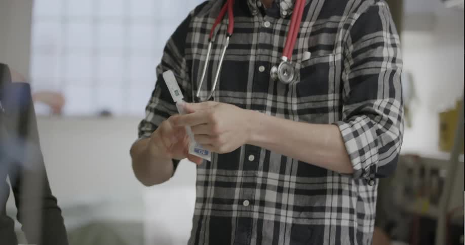 Male nurse preparing an injection at a hospital