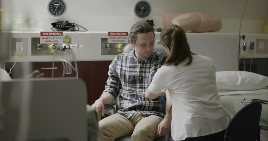 A man is getting his blood pressure tested