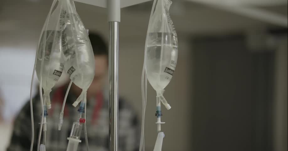 Iv bags hang from a metal pole