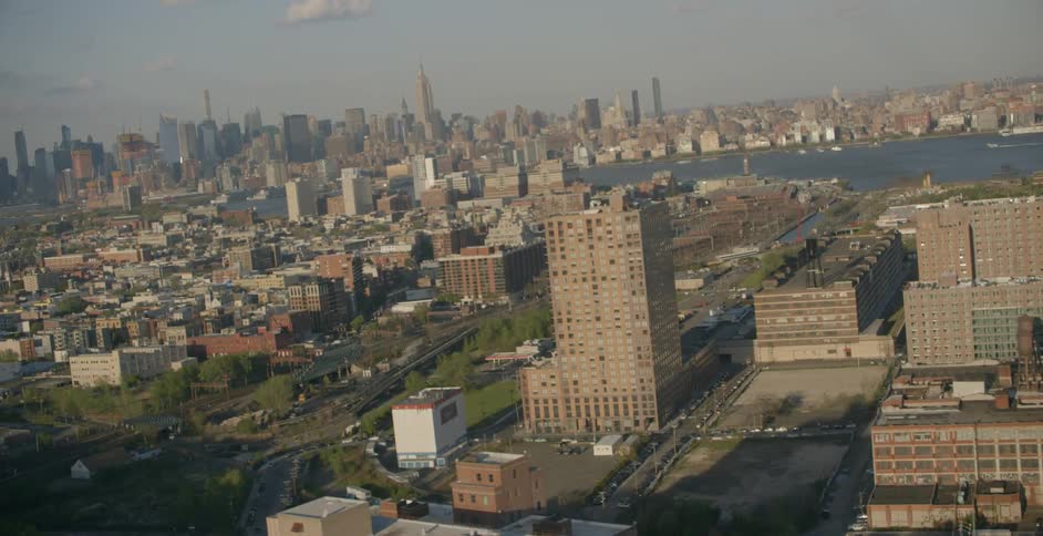 Aerial view of two large cities with a river running between them