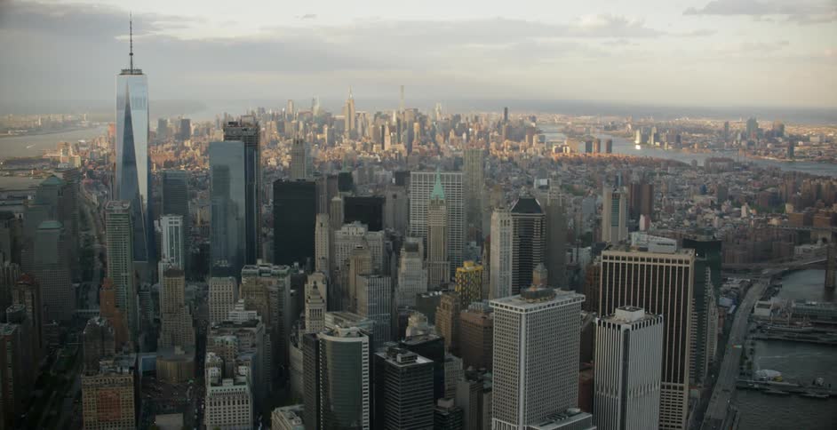 The city has many tall buildings on a cloudy day