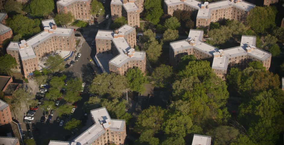 An overhead view of a city and its buildings and trees
