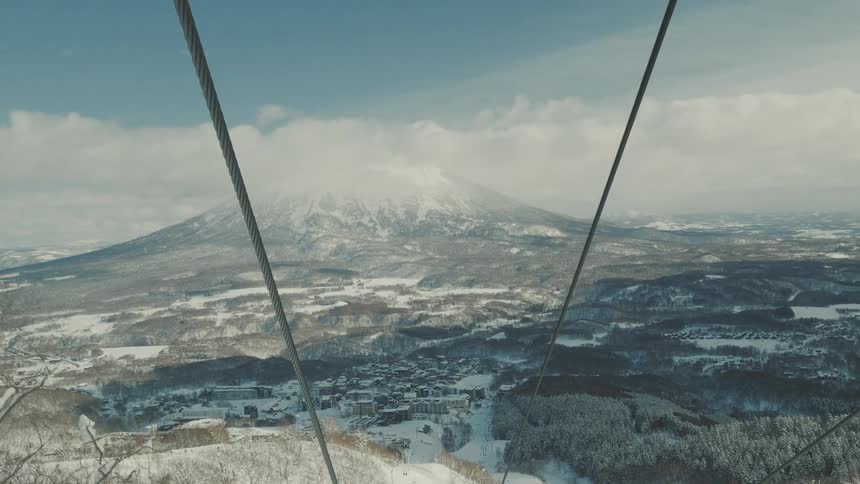 The ski lift moves up the mountain
