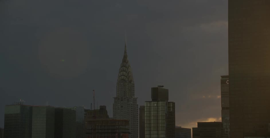 Many buildings downtown at sunset
