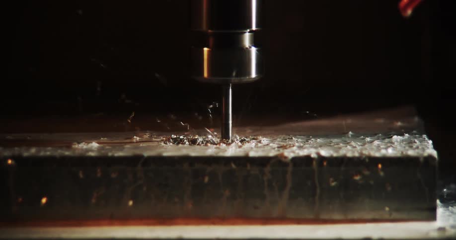 The machine is drilling into the metal