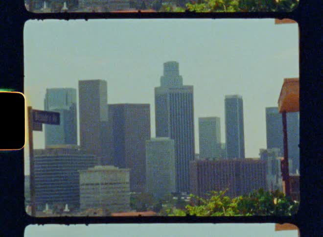 City skyline viewed through a film strip frame