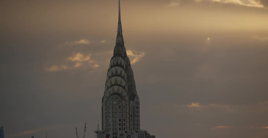 Clouds pass by the empire state building