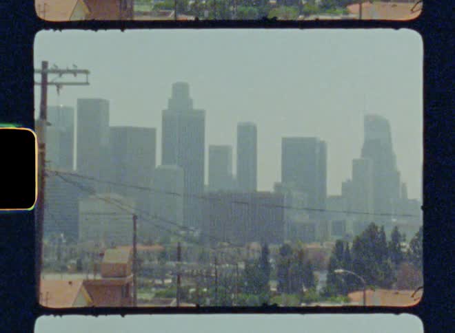 Moving view of a metropolis with skyscrapers in urban neighborhoods