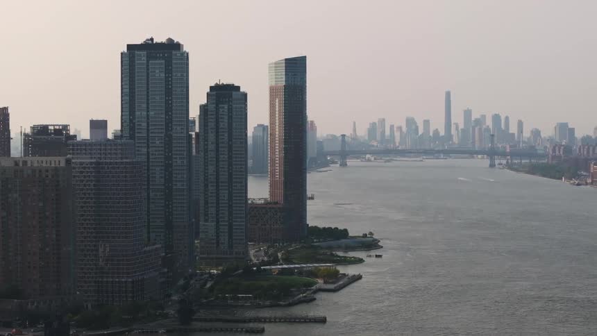 Aerial panorama of a metropolis with skyscrapers on the seafront