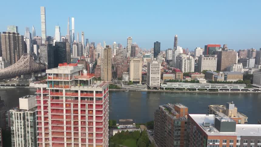 Aerial view of a metropolis with large buildings surrounded by the sea