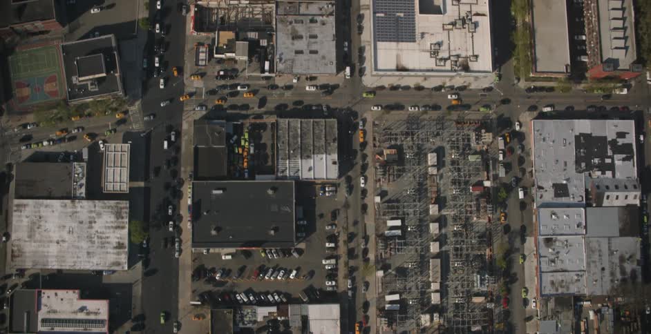 Aerial view of the city with cars on the roads