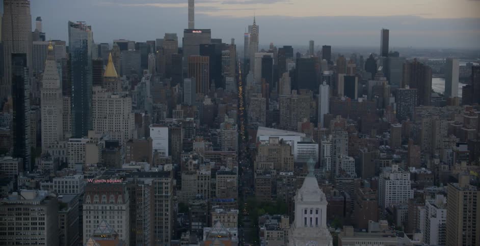 An aerial view of a large city with many tall buildings