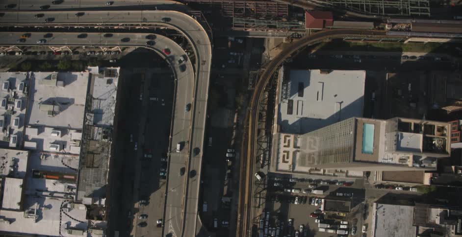 A city with traffic driving on overpasses