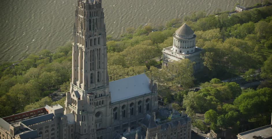 Aerial view of a church next to a river