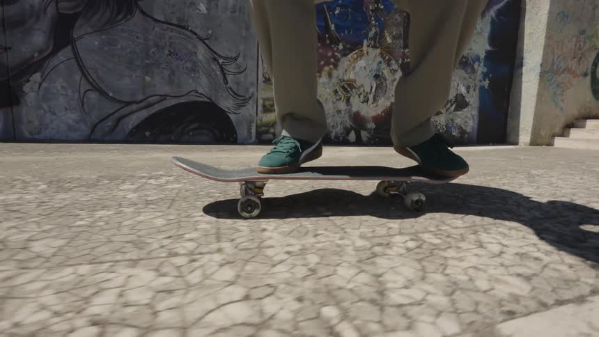 A skateboarder performs a trick in front of a vibrant graffiti wall showcasing skill and urban art