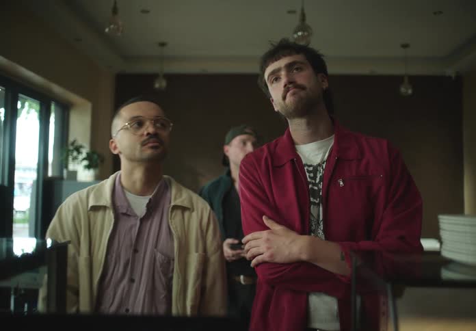 Men in a line at a restaurant indoors