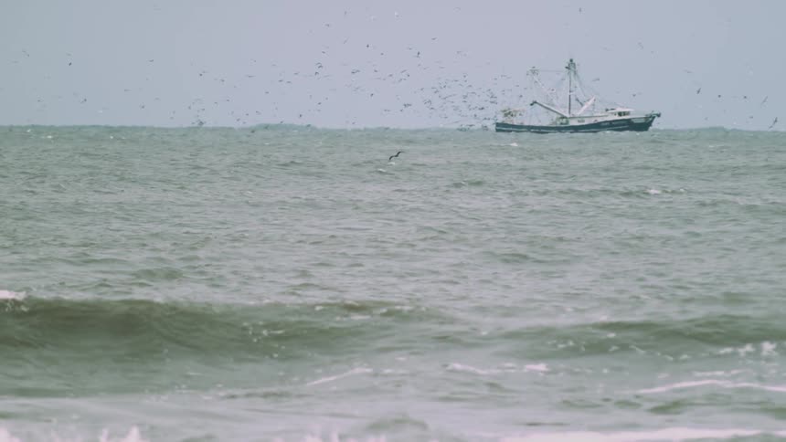 Ship in the distance in some fairly rough waters