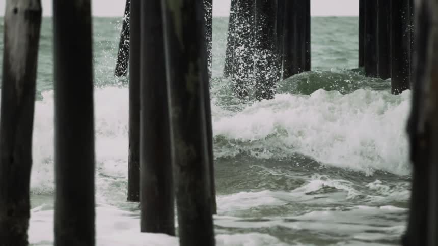 Water splashing up on the pier legs