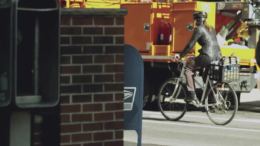 Woman riding her bicycle on a city street