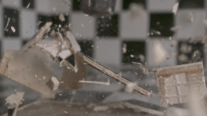 A sledge hammer striking a tile countertop