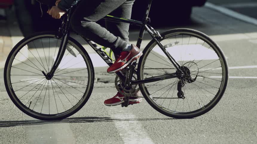 A man rides a bicycle on a street