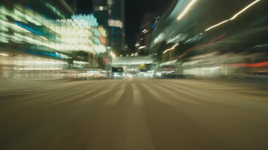 Rapid transit through the city causes city lights to form streaks of light at night