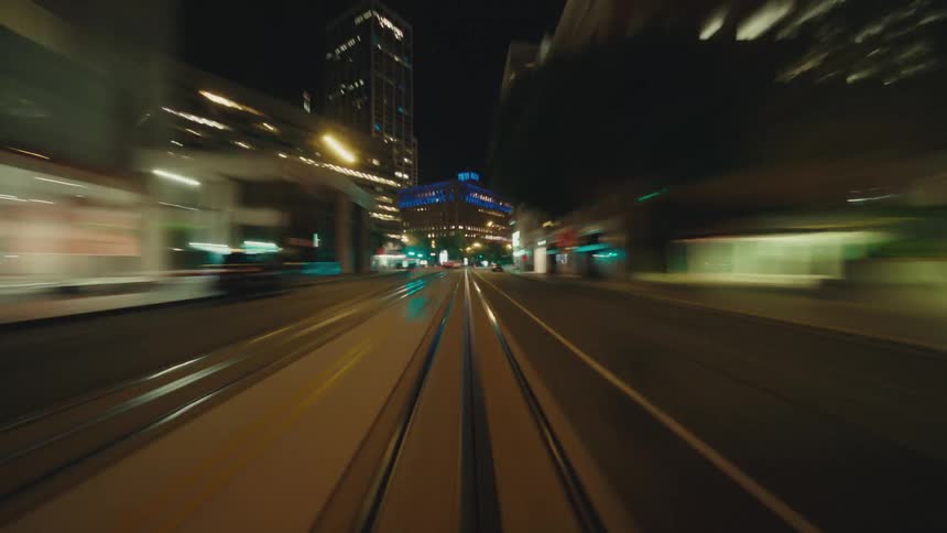 Night and moving view of a metropolis at night with illuminated streets