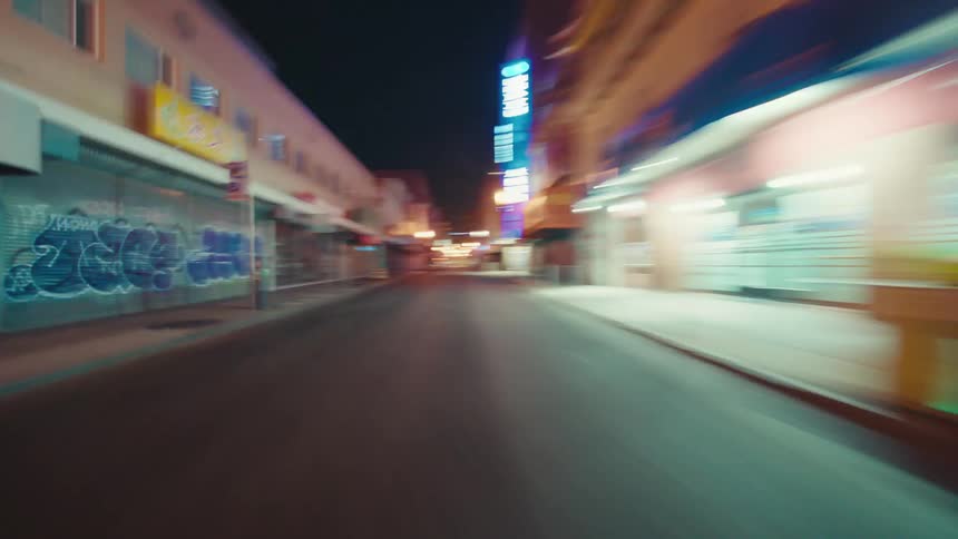 City lights illuminate city streets during the night
