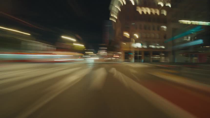 Night view of a city with streets with vehicle traffic