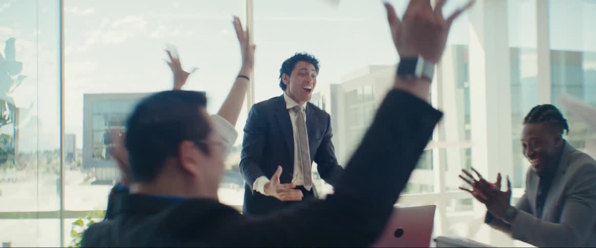 Group of people celebrating in the office