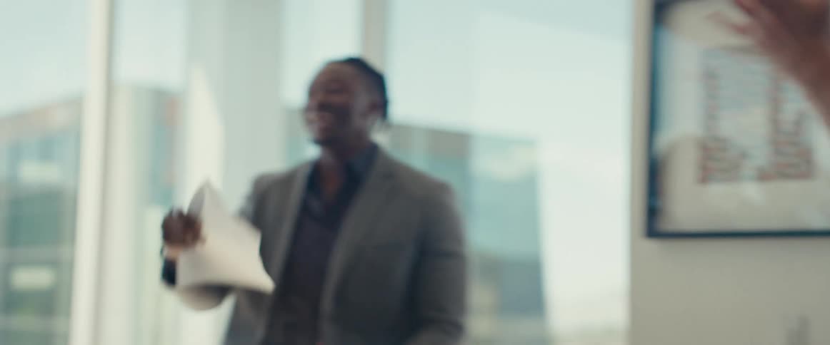 Group of people in an office celebrating happily