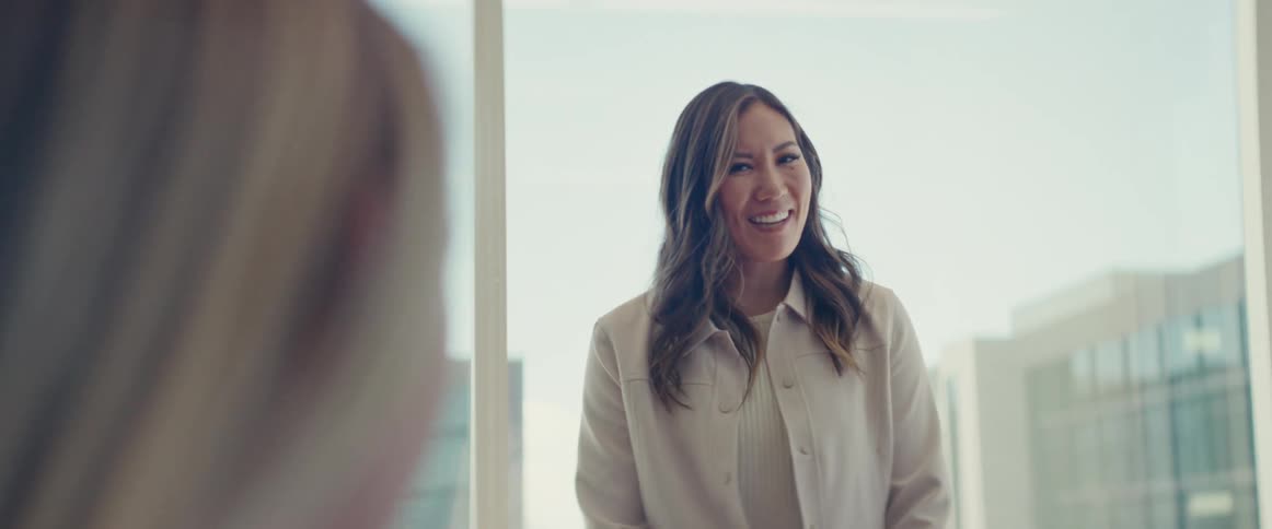 A woman is talking in the office