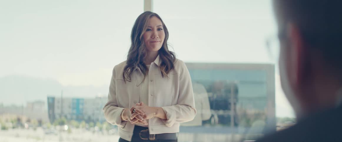 Woman standing lecturing in an office environment