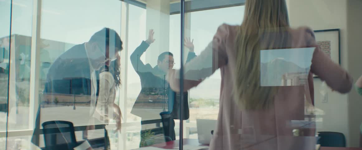 Group of people inside an office celebrating
