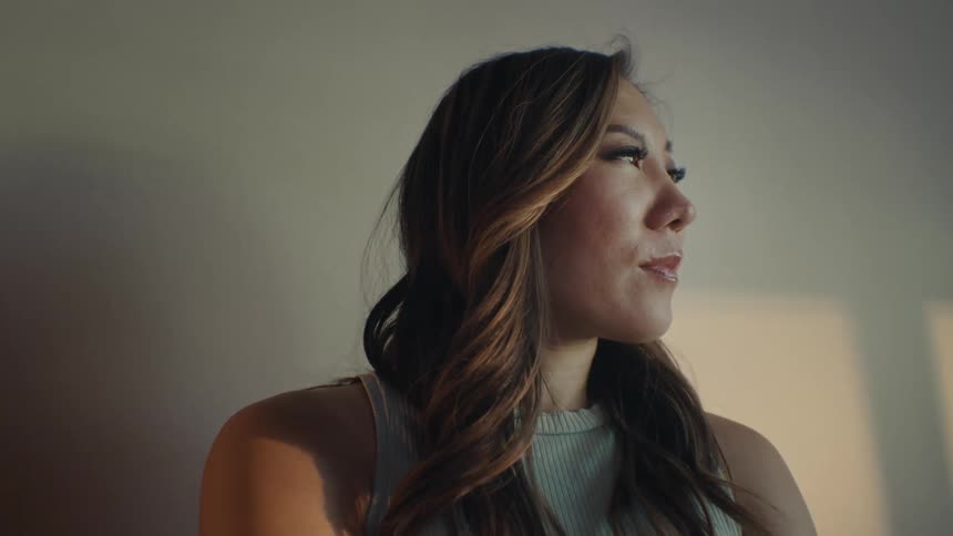 A woman looks around and smiles