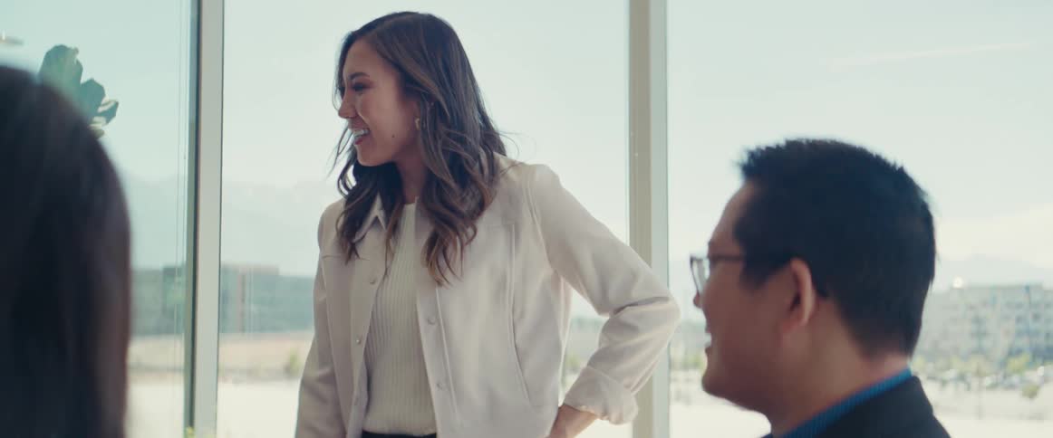 Woman leads a meeting at the office in a building near the outskirts of town