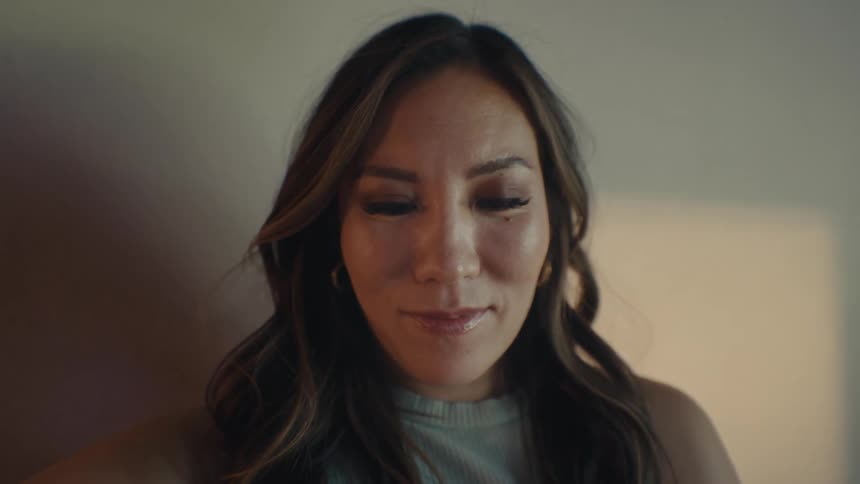 Close up of the face of a woman with her eyes closed