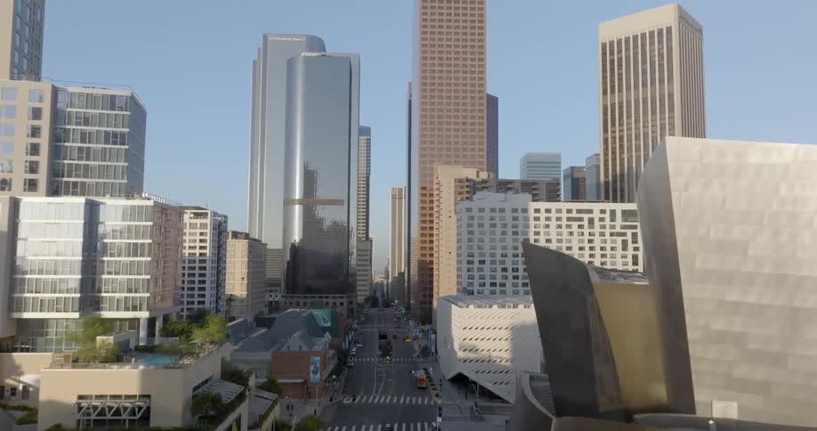 Aerial of a downtown metropolis and skyscrapers on a sunny day